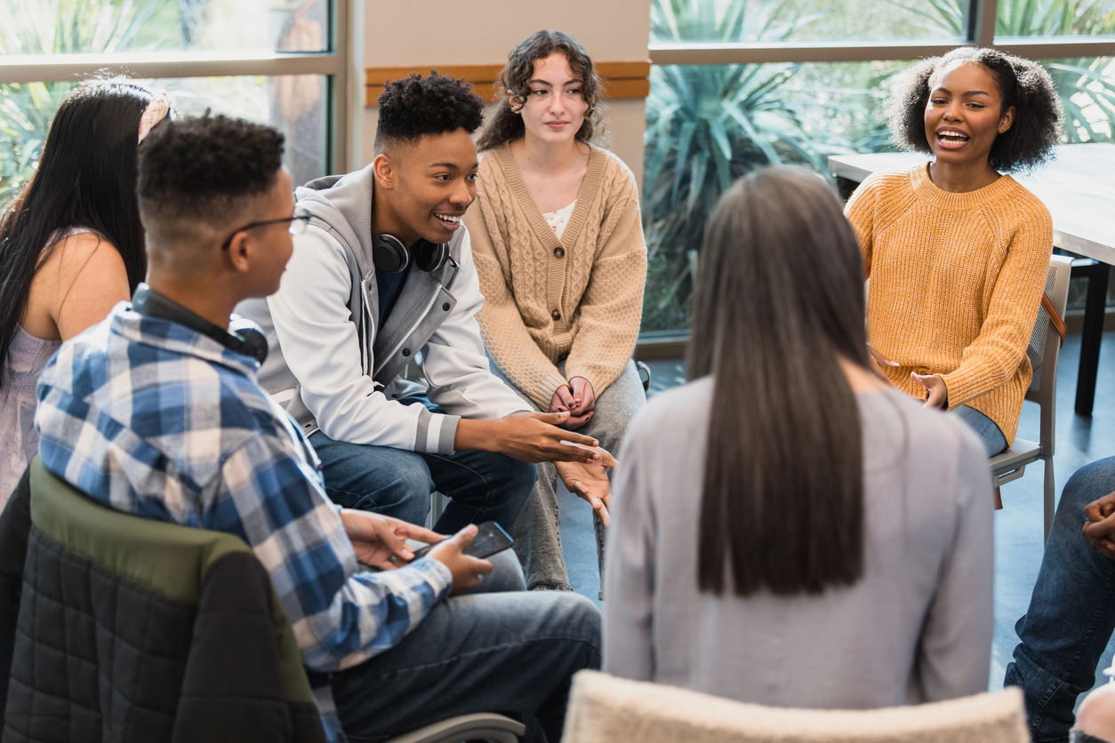 group of teens doing therapy together.