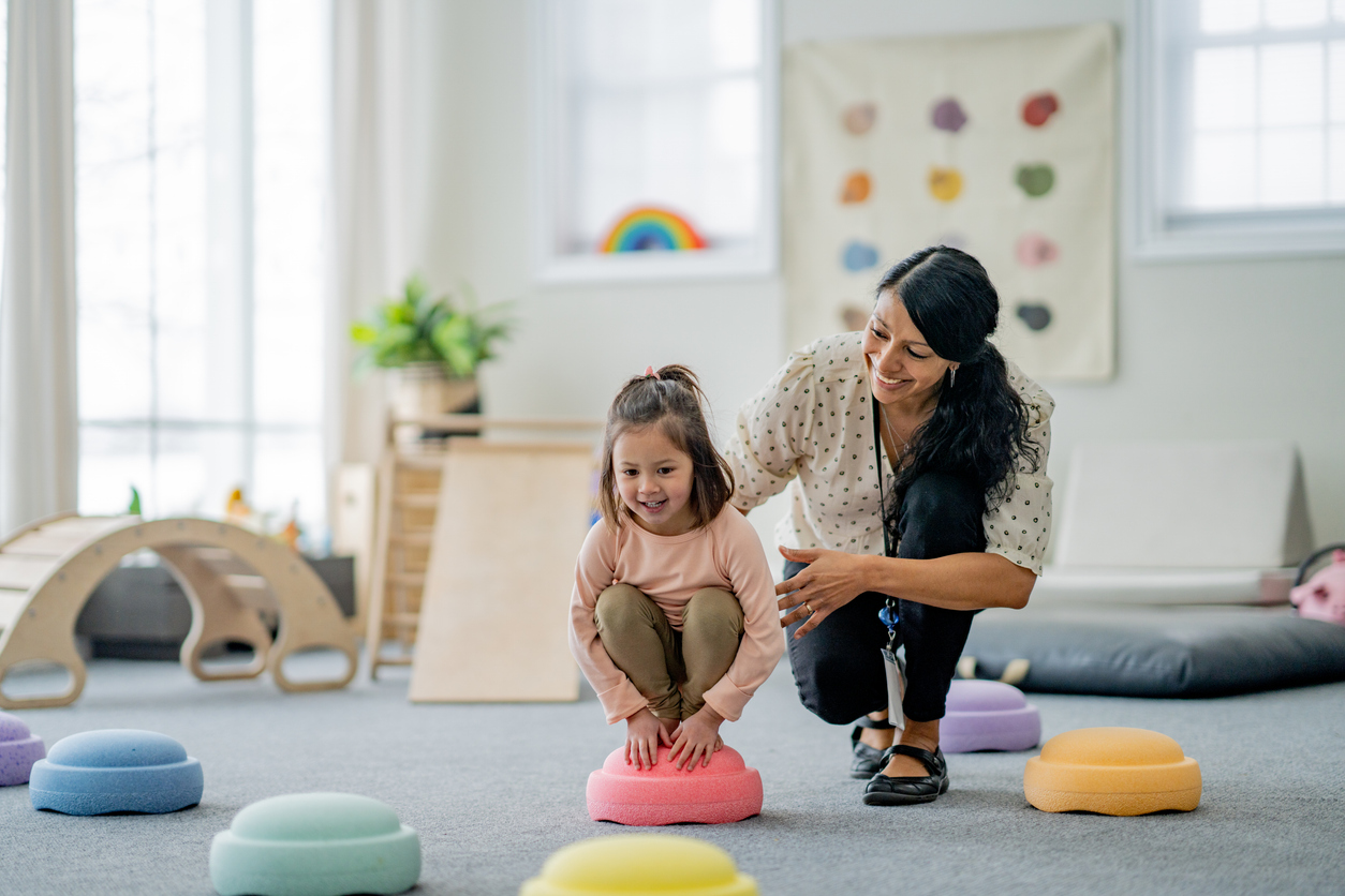 young girl doing play therapy.