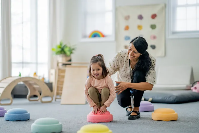 young girl doing play therapy.