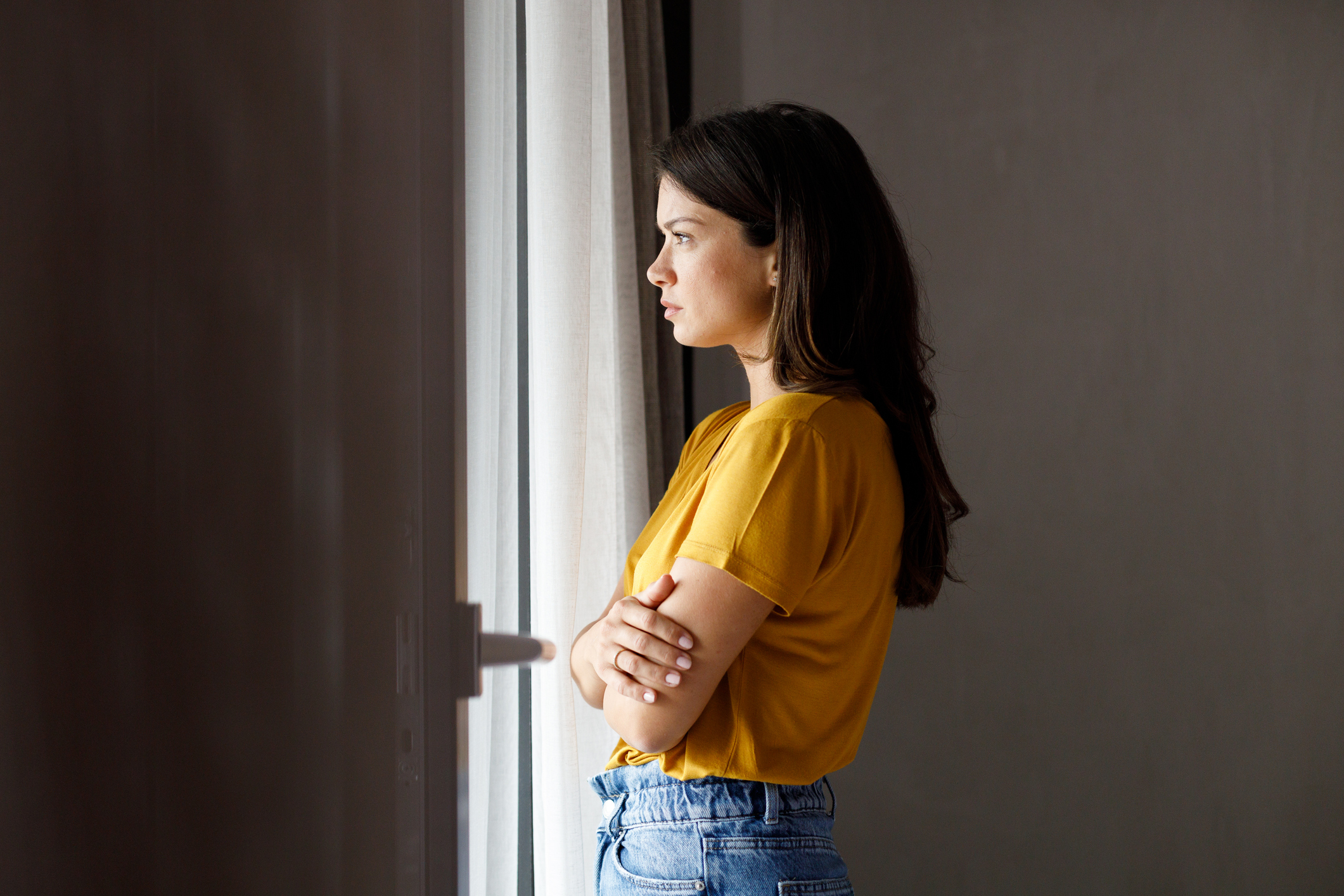 woman looking out the window